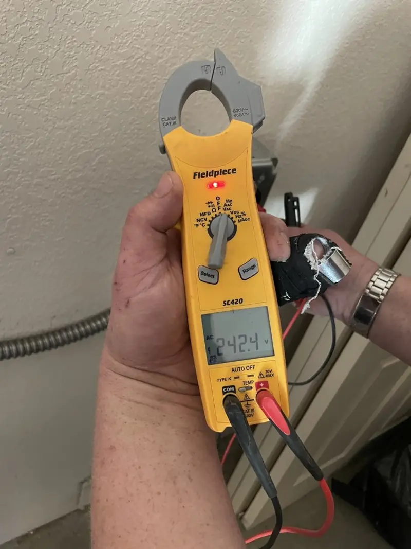 Voltage testing with clamp meter during Outlet Installation in San Buenaventura (Ventura)